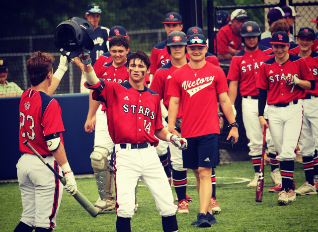 BNL senior Grant Dalton (14) taps helmets with Walker Ward (23) to celebrate Dalton`s home run on Senior Day.