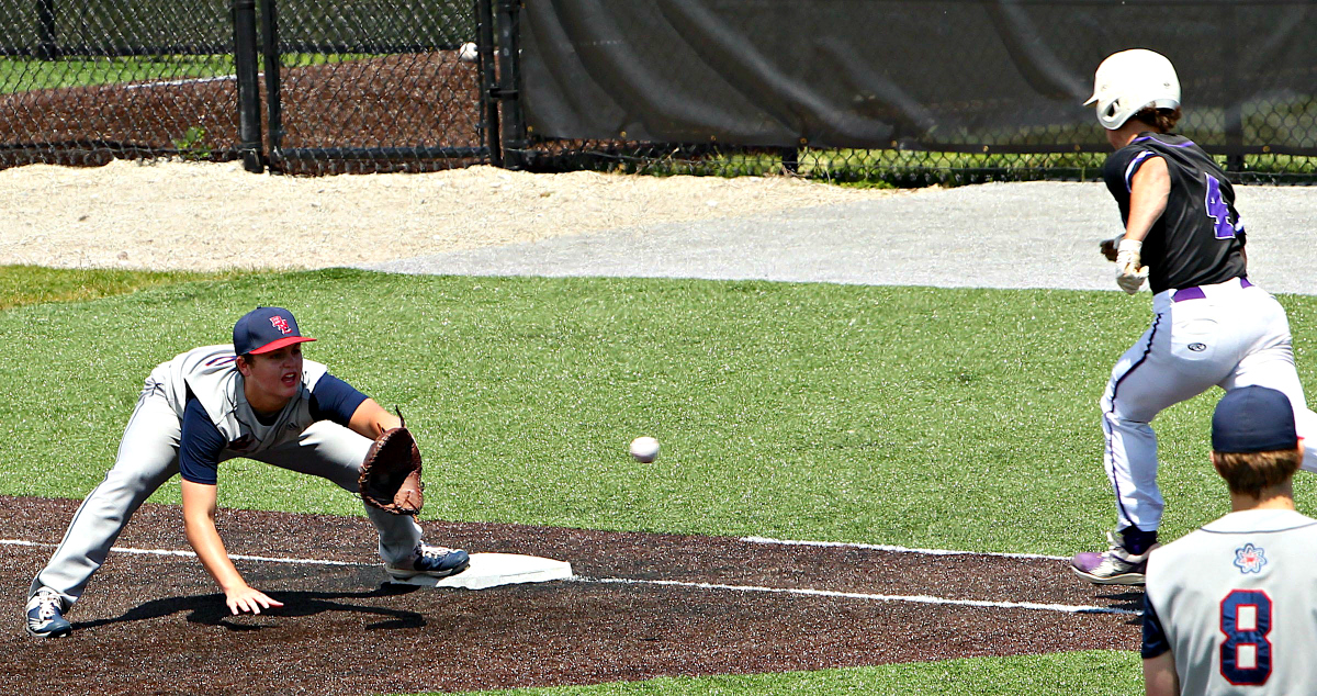 Bedford North Lawrence`s Kaedyn Bennett (22) gets the out as Seymour`s Charlie Longmeier (4) runs to first base during the sectional semi-final game with Seymour on Saturday, May 28, 2022 at Jennings County.